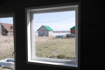 installation of a plastic window in a frame house