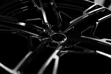 Black alloy wheels for premium cars, close-up. Purchase and replacement of autodisks