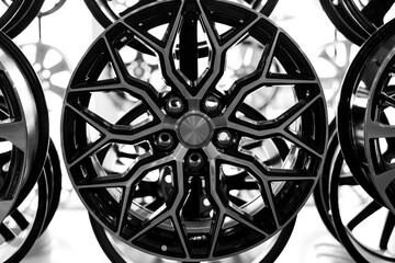 Black alloy wheels for premium cars, close-up. Purchase and replacement of autodisks