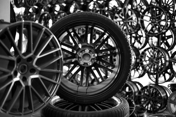 Black alloy wheels and wheels for cars. Purchase and replacement of tires and car disks