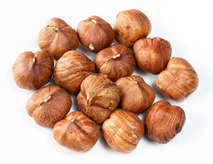 several of shelled hazelnuts closeup on white