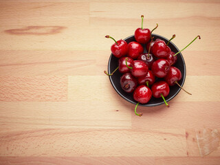 Fresh cherries on a wooden background