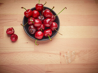 Fresh cherries on a wooden background