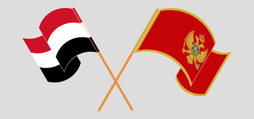 Crossed and waving flags of Yemen and Montenegro