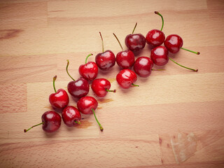 Fresh cherries on a wooden background