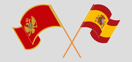 Crossed and waving flags of Montenegro and Spain