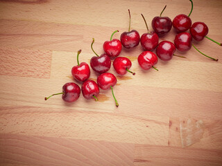 Fresh cherries on a wooden background