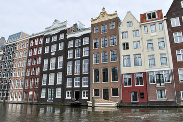 Fototapeta premium Traditional Dutch medieval buildings in Amsterdam, Netherlands. view from the canal.