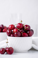 Two small bowls of beautiful fresh ripe cherries