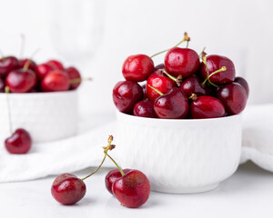 Two small bowls of beautiful fresh ripe cherries