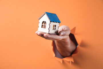 hand holding a house