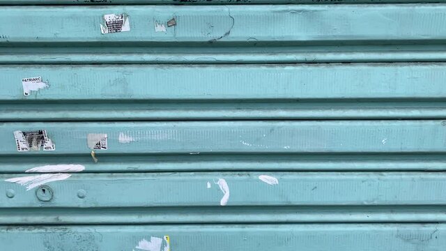 Garage texture background teal color, closed store in street