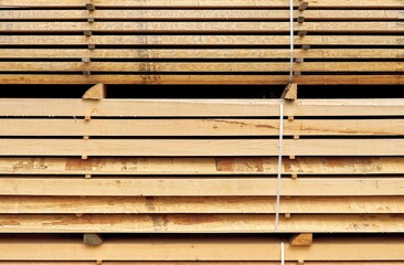 Stacked wooden boards in a sawmill Bottleneck on the sawn timber market