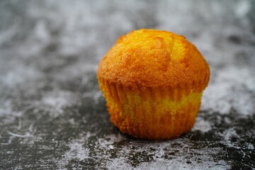 Single moist Corn Muffin isolated with copy space, selective focus