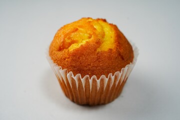 Single moist Corn Muffin isolated with copy space, selective focus