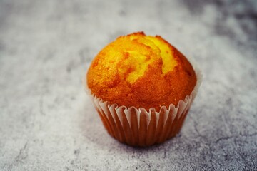 Single moist Corn Muffin isolated with copy space, selective focus