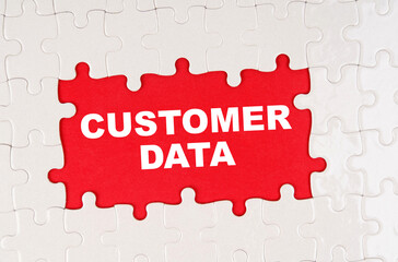 In the middle of the puzzles on a red background it is written - CUSTOMER DATA