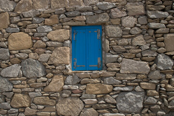 Fototapeta na wymiar old window on a stone wall