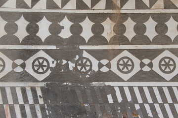 Carved geometric shapes on a wall in the Pyrgi village at South Chios Island