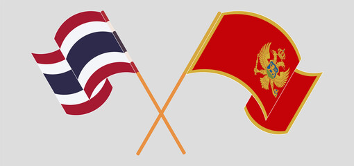 Crossed and waving flags of Thailand and Montenegro