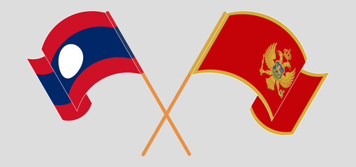 Crossed and waving flags of Laos and Montenegro