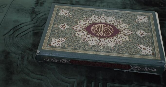 Close up of a Koran Book panning left to right
