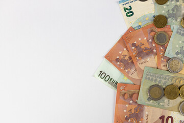 Background from euro money, copy space. Few banknotes and coins, different denomination. Concept cash, salary, wealth, sweet life, credit, finance, business, deposit, insurance. Top view, flat lay