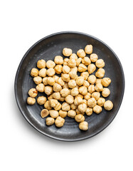Peeled roasted hazelnut kernels isolated on white background.