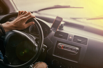 Obraz na płótnie Canvas driver drives a car on a sunny day
