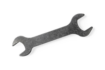 Flat bicycle wrench isolated on white background. Metal open end spanner macro. Vintage scratched tool for repair and service equipment. Design element.