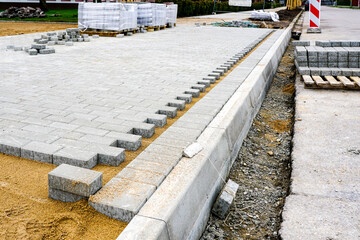 view of the pavement construction site, concrete tiles and the prepared gravel base