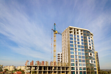 Fototapeta na wymiar High residential apartment building under construction. Real estate development.