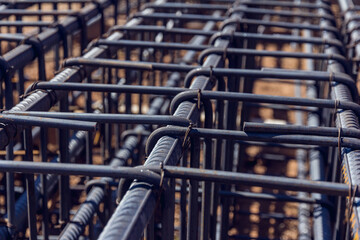Close up view of reinforcement of concrete Construction rebar steel work reinforcement at a construction site. Steel bar construction for concreting - obrazy, fototapety, plakaty