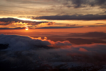 clouds and mountain at sunset