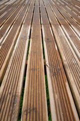 Wooden walk track in green park