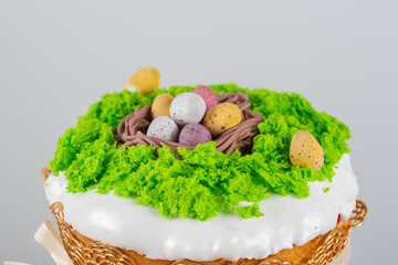 Easter cake made from yeast dough, decorated with edible moss with a nest