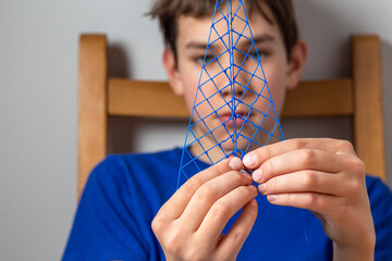 Boy creates a new technology by 3D printing. Concept of innovations 