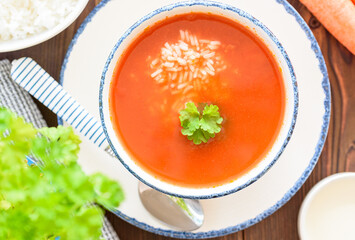 Top view of a tomato soup with rice