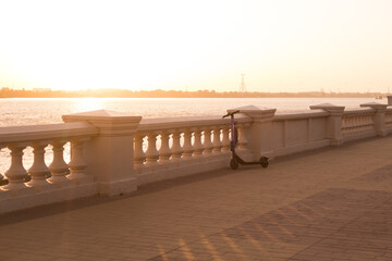 Sunset or sunrise on the river embankment at summer evening