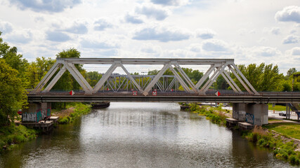 Fototapeta na wymiar Steel railway viaduct over the water. 
