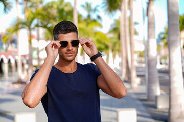 Handsome young man portrait. Men wearing fashionable sunglasses