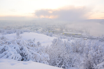 MURMANSK, RUSSIA - FEBRUARY 10, 2021: Panoramic view to snowy city from Defenders of the Soviet Arctic during the Great Patriotic War monument also known as Alyosha