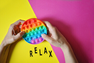 Silicone colorful antistress toy pop it. New trendy popular toy for children and adults. Push PopIt Bubble. Concept relax take it easy