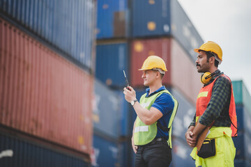 worker teamwork and partner of foreman, engineer, and businessman working in an international shipping area, concept of business industrial and working in container yard.
