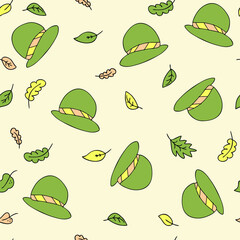 Seamless pattern of a cute green hats and autumn leaves. Perfect for scrapbooking, textile and prints. Hand drawn cartoon style vector illustration.
