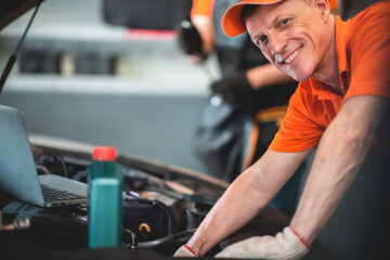 background of mechanic working about auto car engine service, technician having automotive job to maintenance or repair automobile in motor garage, business industrial auto car engine