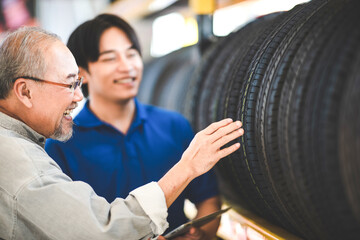 man customer client choosing and buying a retail tire at automobile sale shop store, transport...
