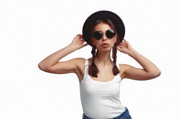 Girl with sunglasses holding hat with both hands, isolated over white wall