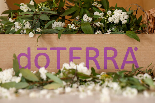 DoTERRA Packaging Box Sitting In Bed Of White Flowers