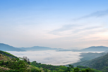 Surreal landscape of morning foggy..Morning clouds at sunrise.Landscape of fog and mountains of northern Thailand.